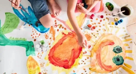 Kids Painting Colorful Art On Paper